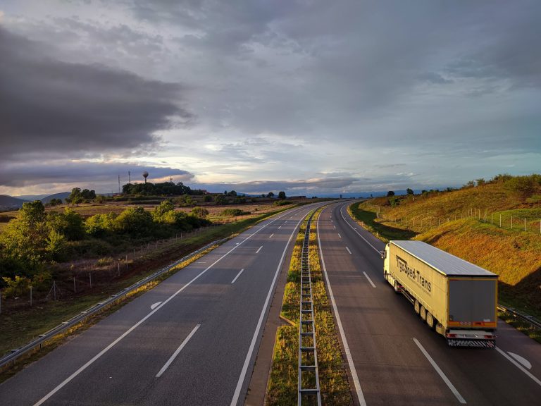 logistics truck driving on highway road in Ontario, Canada