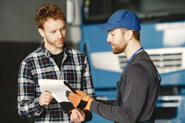 a hvac service tech showing invoice to customer
